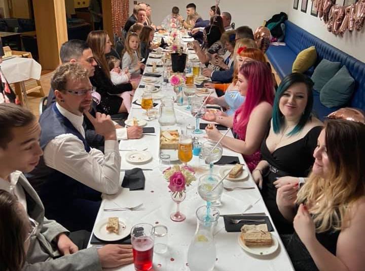 A family enjoy New Years Eve together in a hotel