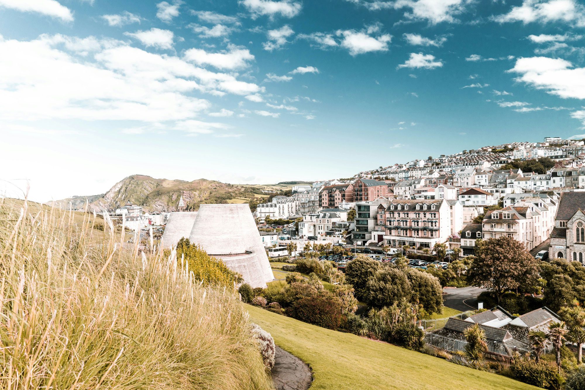 A photo of the Landmark Theatre in Ilfracombe nestled amongst the surrounding landscape