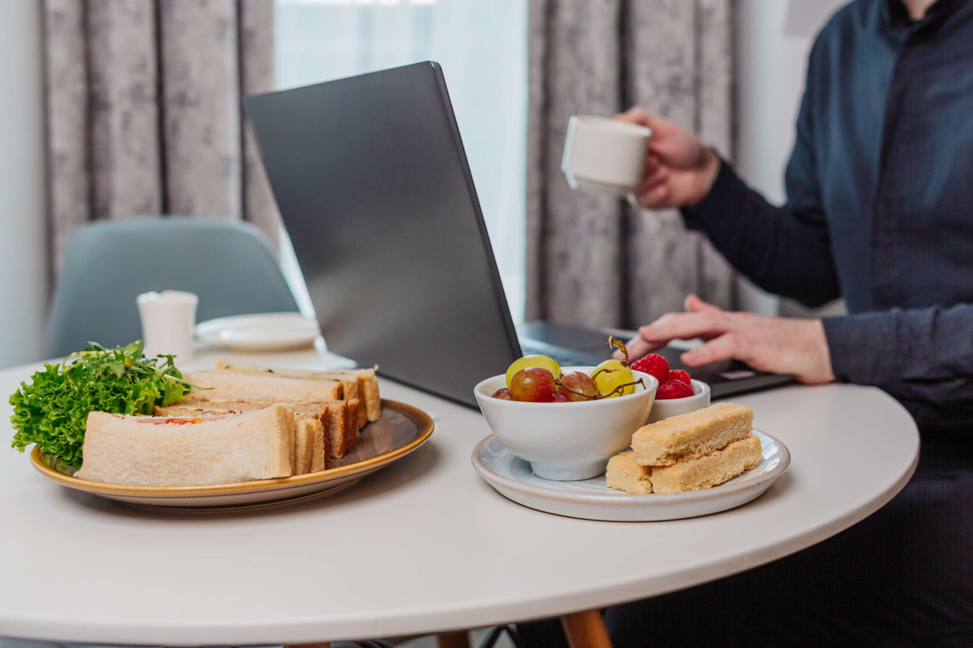 A man has a working lunch in a business hotel in North Devon